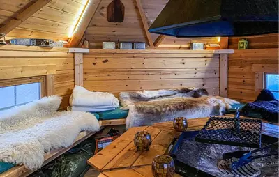 a room with three beds in a log cabin at Nice Home In Gol With Kitchen in Golsfjellet