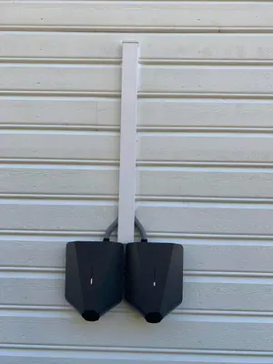 a pair of speakers hanging on a garage door at Gjerdset Turistsenter in Isfjorden