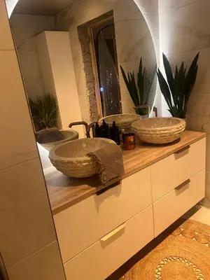 a bathroom with two sinks and a mirror at Sentral leilighet i Trondheim in Trondheim