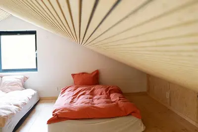 a bedroom with a bed and a window in it at Cozy Nature Retreat, Danish Design w Jacuzzi option in Sogndal