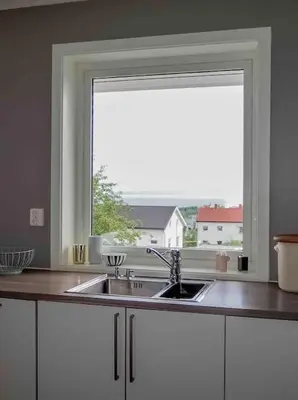 a kitchen with a sink and a window at Familiebolig med nydelig utsikt in Trondheim