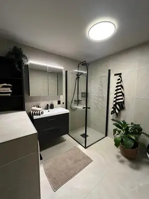 a bathroom with a shower and a sink and a toilet at Sognefjorden View in Leikanger