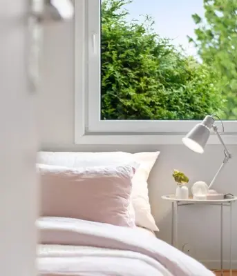 a bedroom with a bed and a window at Tranquil Haven Villa in Ålesund