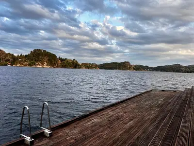 a dock on a large body of water at Fjord-View Retreat with Free Parking and Fast Internet in Nese