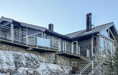 a house on top of a cliff at Awesome Home In Fevåg With Wifi in Fevåg