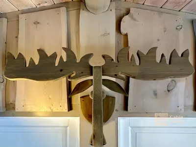 a wooden cross hanging on a wall at Family-friendly cabin at Sjusjøen with ski trails, sauna and fireplace in Ringsaker
