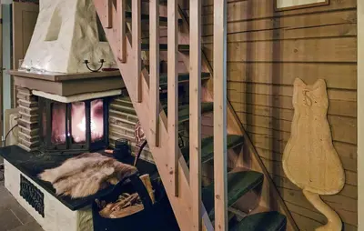 a staircase in a room with a fireplace at Gorgeous Home In Uvdal With Wifi in Uvdal