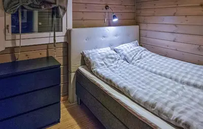 a bed in a room next to a dresser at Gorgeous Home In Uvdal With Wifi in Uvdal