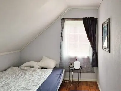 a bedroom with a bed and a window at 8 person holiday home in Masfjordnes-By Traum in Masfjorden