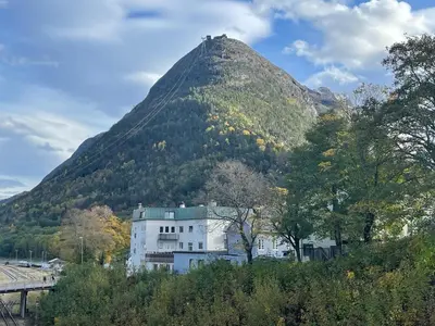 a mountain with a building in front of it at Bakkebo Rampestreken in Åndalsnes