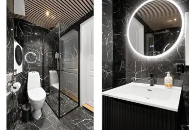a bathroom with a sink and a toilet and a mirror at Renovated 2024 - Viking inspired - Behind bryggen in Bergen