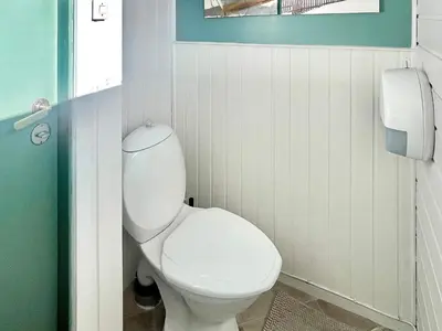 a bathroom with a white toilet in a room at 6 person holiday home in Dalsøyra-By Traum in Dalsøyra