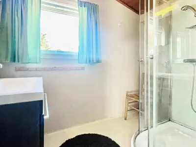 a bathroom with a shower and a sink at 6 person holiday home in Dalsøyra-By Traum in Dalsøyra