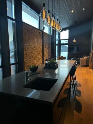 a kitchen with a sink and a counter at Pow Panorama - High standard Mountain home in Sogndal