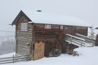 a log cabin in the snow with snow at Trevet by Norgesbooking - cabin close to skicenter in Ål