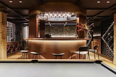 a bar with a pool table and some chairs at Chalet Strandafjellet in Stranda