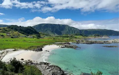 an aerial view of a beach with mountains in the background at 2 Bedroom Lovely Home In Raudeberg in Raudeberg