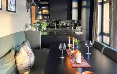 a table with two candles and wine glasses on it at Amazing Apartment In Noresund With Wifi in Noresund