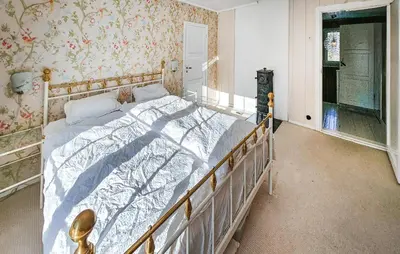 a bedroom with a large bed in a room at Awesome Home In Noresund With Wifi in Noresund