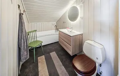 a bathroom with a sink and a toilet and a tub at Gorgeous Home In Rjukan With Kitchen in Rjukan