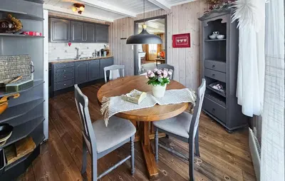 a kitchen and dining room with a wooden table and chairs at Gorgeous Home In Rjukan With Kitchen in Rjukan