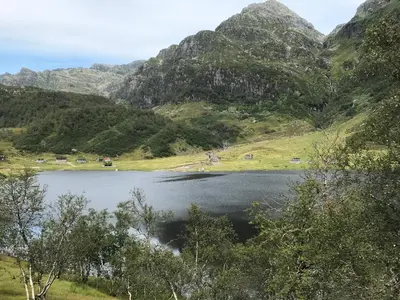 a view of a lake with mountains in the background at Kvamskogen & Hardanger Holliday homes in Norheimsund
