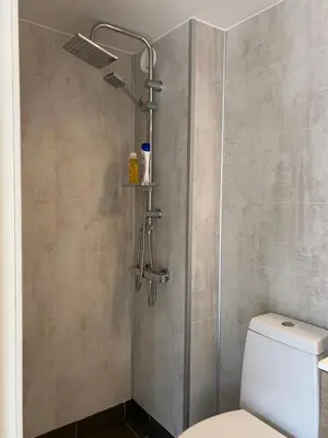 a shower stall with a toilet in a bathroom at Trolltun, Frystevegen 4 in Ulvik