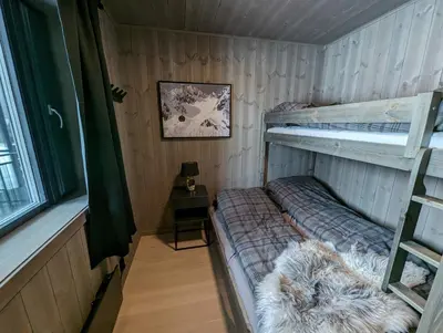 a room with two bunk beds in a house at Ski in/out Appartment Hemsedal in Hemsedal