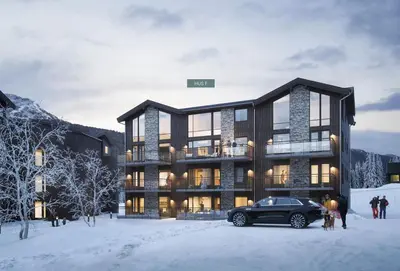 a black car parked in front of a building in the snow at Ski in/out Appartment Hemsedal in Hemsedal