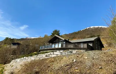 a house on top of a rocky hill at Lovely Home In Valldal in Valldal