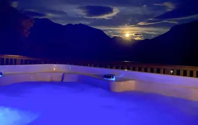 a bath tub with a view of the mountains at Lovely Home In Valldal in Valldal