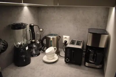 a kitchen counter with various appliances on it at A wonderful estate of two houses for all seasons! in Trysil