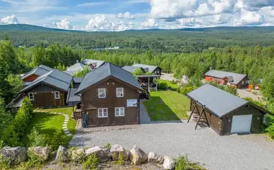 an aerial view of a home with a barn at A wonderful estate of two houses for all seasons! in Trysil