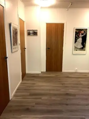 an empty room with a hallway with two doors at Jølster Lake View in Årdal