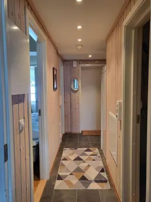 a hallway with a checkered floor in a house at Ski in Ski out Trysil in the mountain of Norway 60m from the Slopes in Trysil