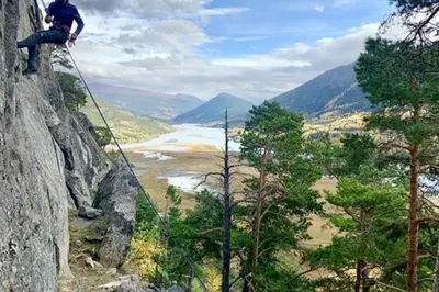 a person standing on a rock overlooking a river at New appartment in Lom inkl bedding in Lom