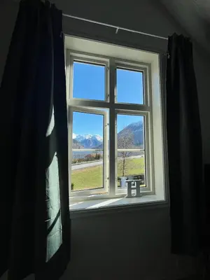a window with a view of a mountain view at Skogly - det gode livet på landet in Stryn