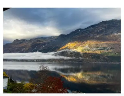 a view of a body of water with a mountain at Fjordview 35 in Lofthus
