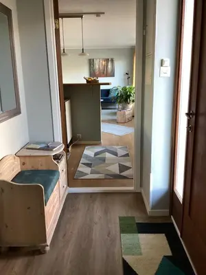 a room with a bed and a hallway at Fjordview 35 in Lofthus