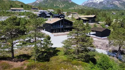 an aerial view of a house in the mountains at Ladebua in Brunstad