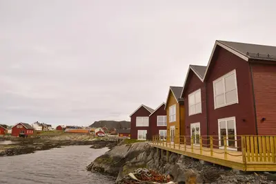 a row of houses next to a body of water at Rorbu i Bud Havn in Bud