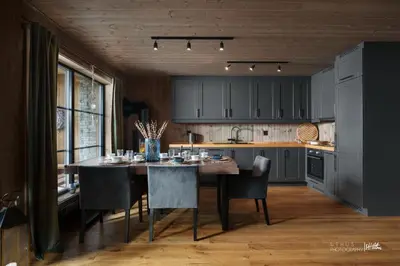 a kitchen with a table and chairs in a room at Nesfjellet in Nes i Ådal