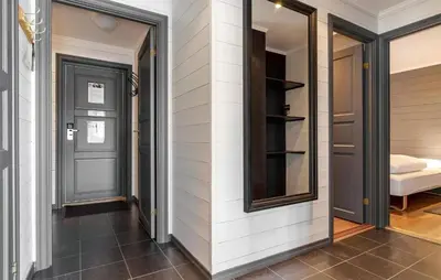 a hallway with a door and a mirror at Pet Friendly Apartment In Hemsedal in Hemsedal