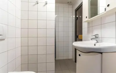 a white bathroom with a sink and a mirror at 3 Bedroom Nice Apartment In Hemsedal in Hemsedal
