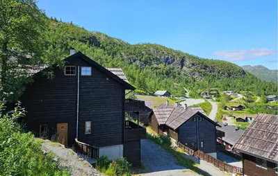 a group of houses on a hill with a mountain at Lovely Apartment In Hemsedal With Sauna in Hemsedal