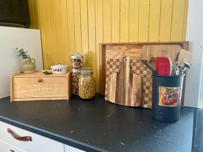 a counter top with various kitchen utensils on it at Friheten! in Notodden