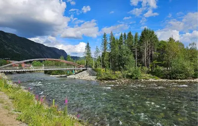 a bridge over a river with at 2 Bedroom Cozy Apartment In Hemsedal in Hemsedal