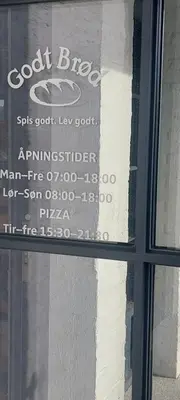 a sign in the window of a building at Bergen city apartment in Bergen