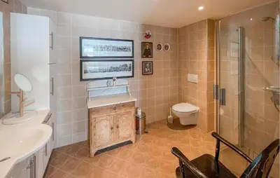 a bathroom with a sink and a toilet and a shower at 3 Bedroom Cozy Apartment In Gålå in Frya