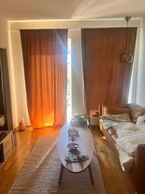 a living room with a coffee table and a couch at Seagull Holiday& Businnes Apartment in Trondheim